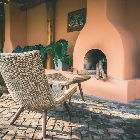 two brown wicker chairs