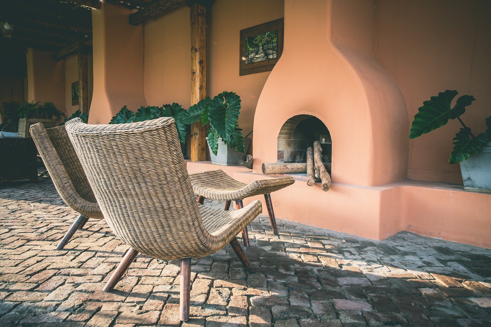 two brown wicker chairs