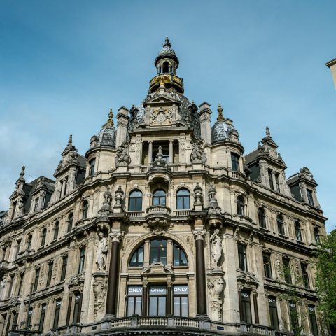 a large building with a clock on the top of it