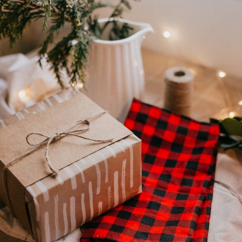 brown and white gift box on red and white checkered textile