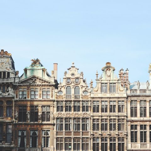 gray and brown building under blue sky