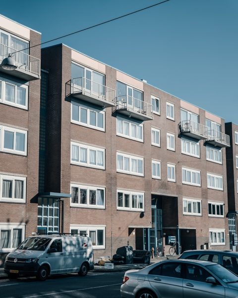 a large brick building with many windows and balconies