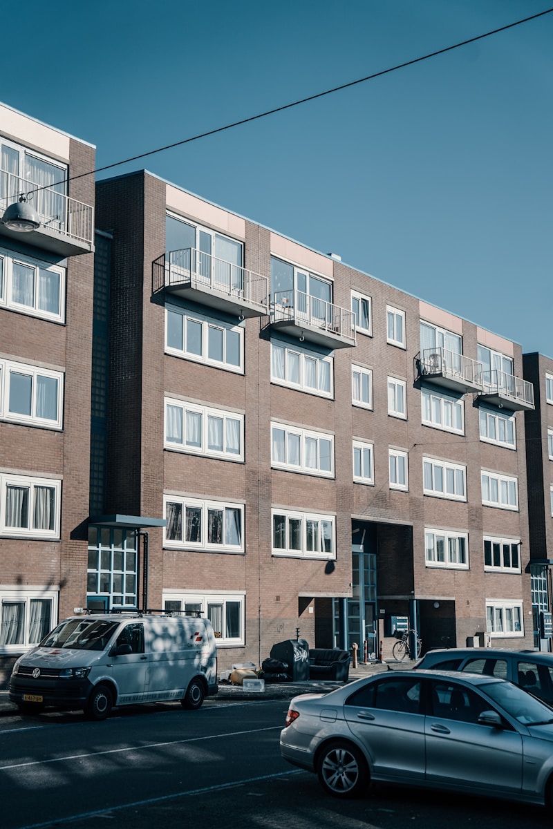 a large brick building with many windows and balconies