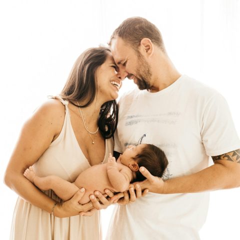 man in white crew neck t-shirt kissing woman in white dress