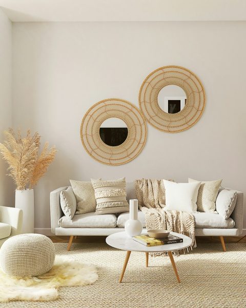 a living room filled with furniture and a mirror