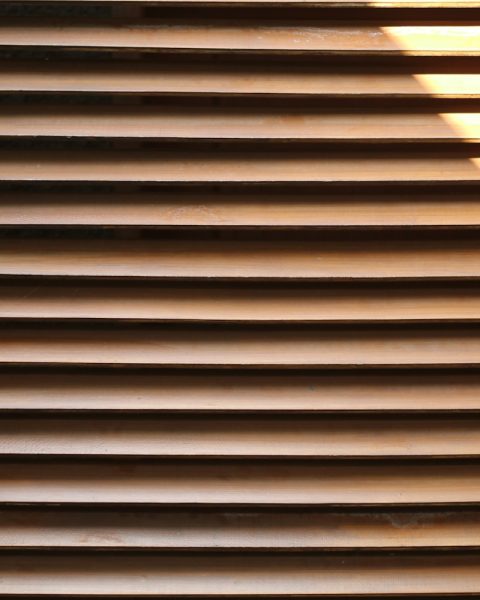 A close up of a window with blinds on it
