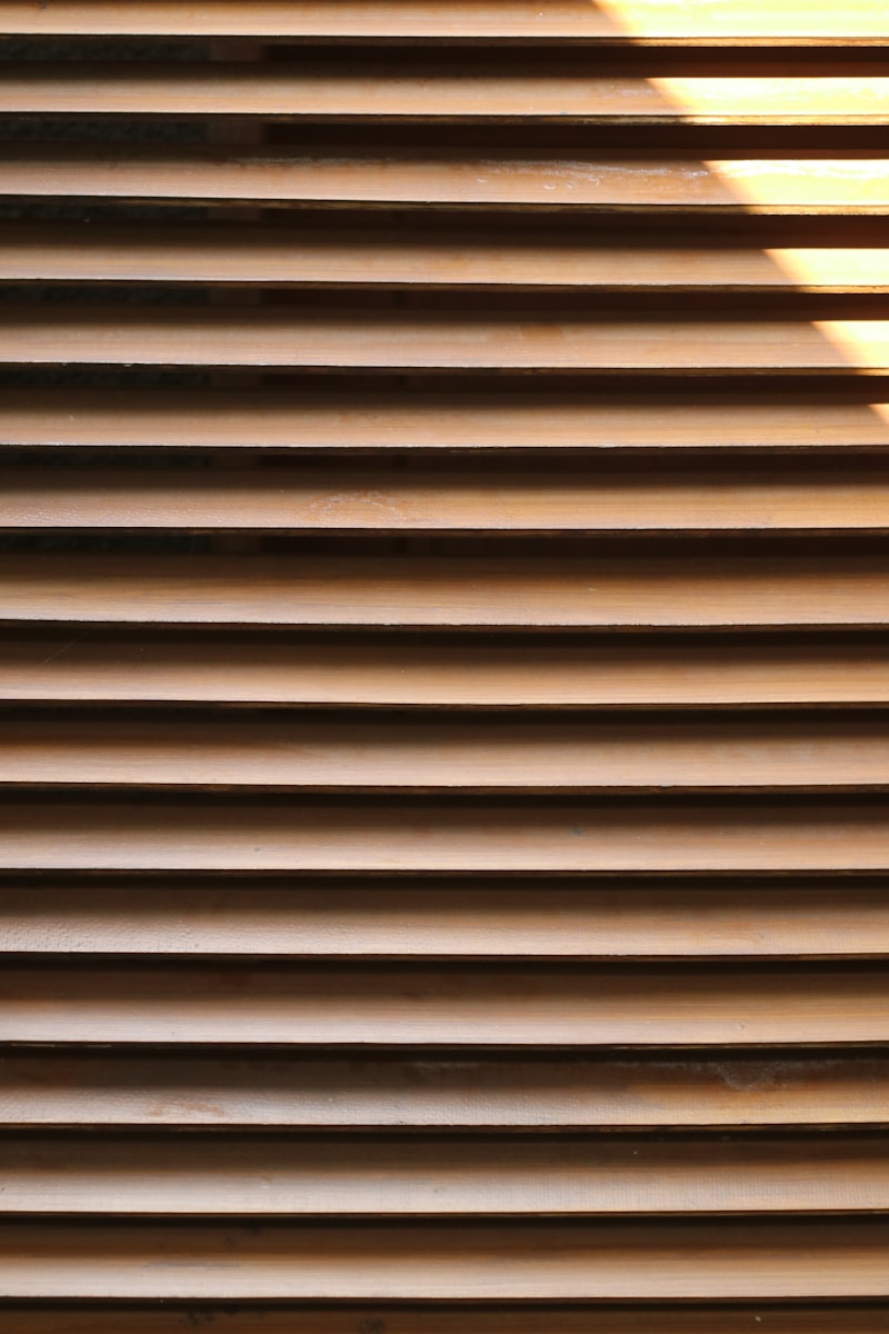 A close up of a window with blinds on it