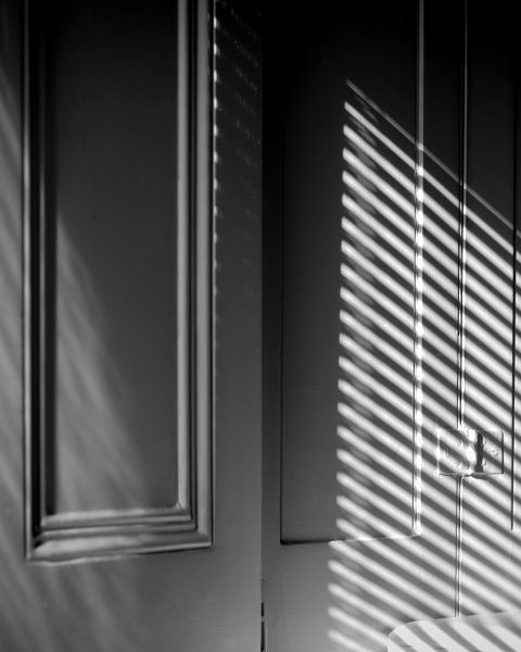 white wooden window with white window blinds